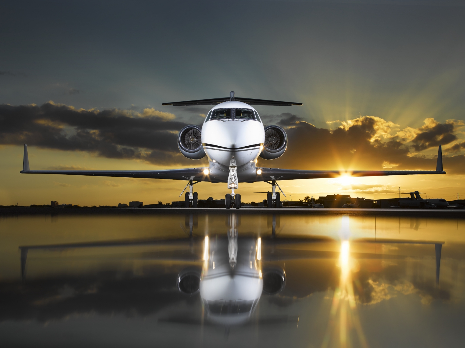 image of private jet and ferrari on tarmac